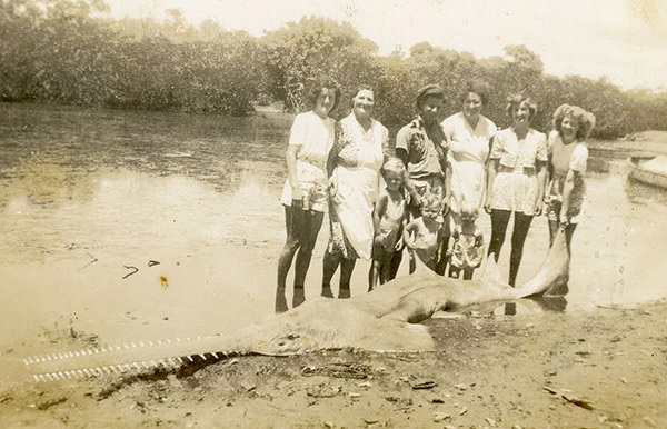The McCray family pose with a sawfish