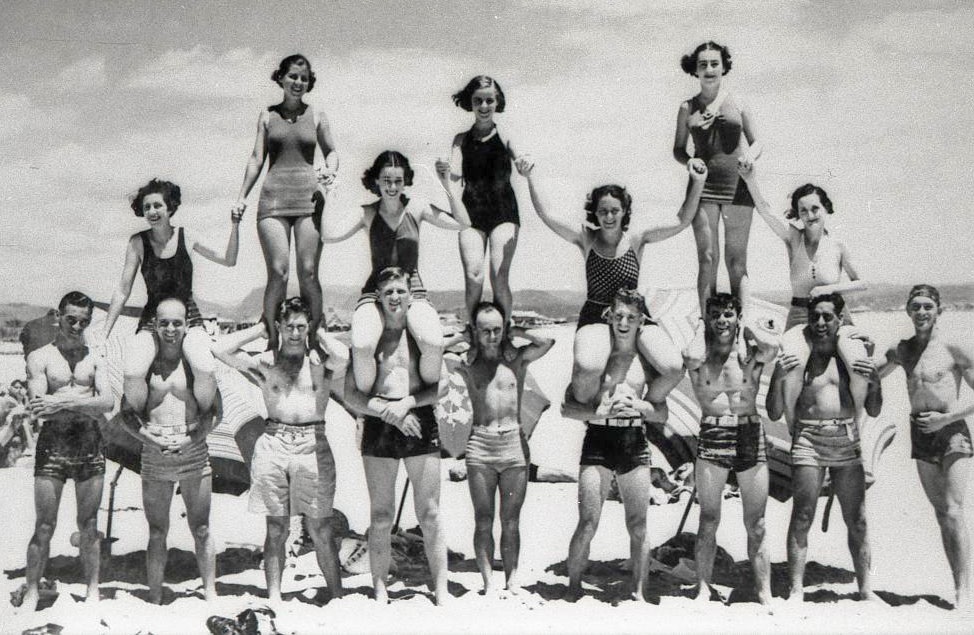 American servicemen and local women on the beach 1944