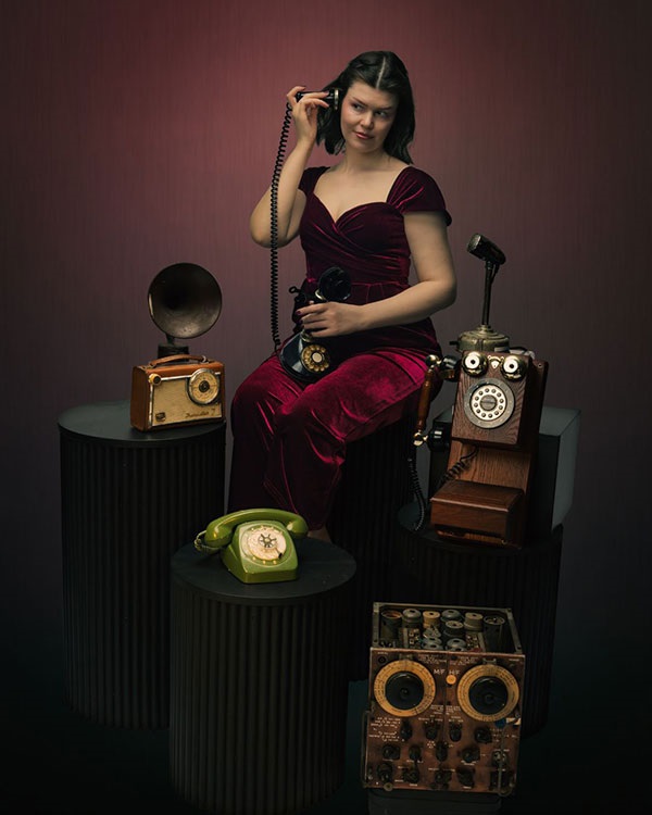 Lady using old fashioned telephone